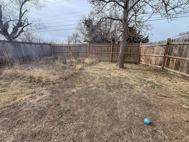 a view of an empty room and a window