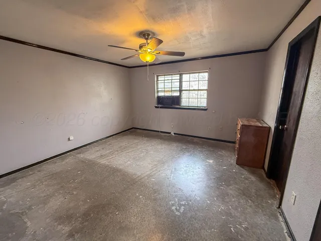 a view of an empty room and a window