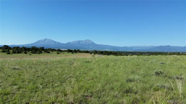 a view of a town with mountains in the background