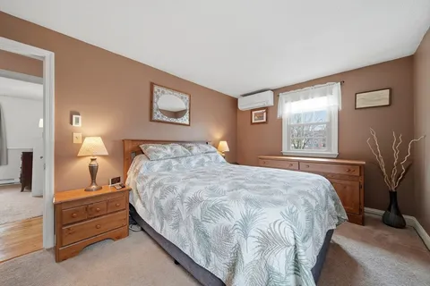 a bedroom with a bed and a tv