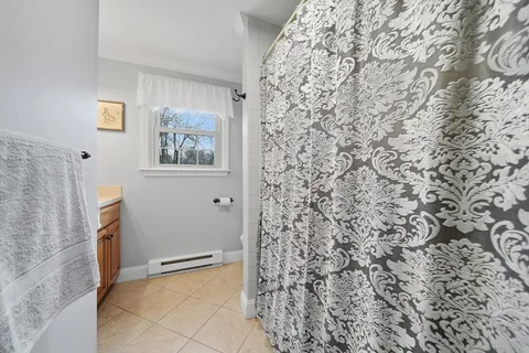 a view of a living room and entryway