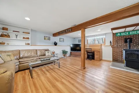 a bed room with furniture and wooden floor
