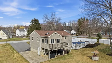 a aerial view of a house with garden and trees