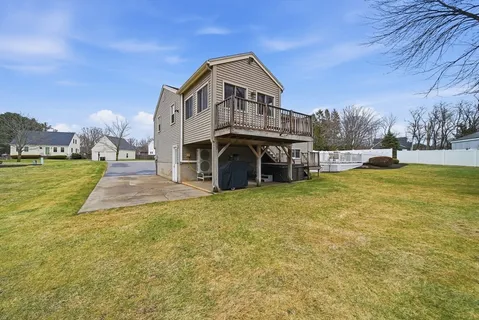a view of a backyard with sitting area