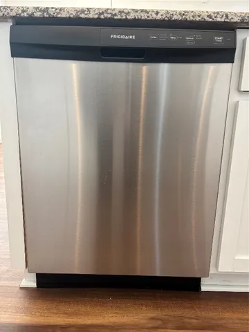 a stove top oven sitting inside of a kitchen