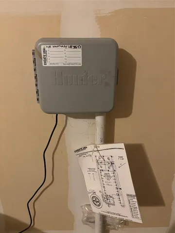 a water heater on the side of a wall
