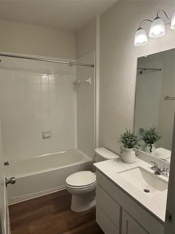 a spacious bathroom with a double vanity sink and a mirror