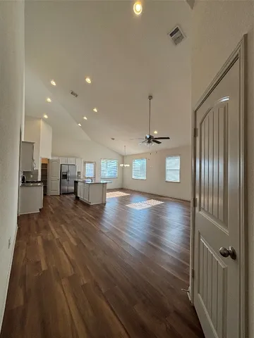 a view of a kitchen with a sink and a window