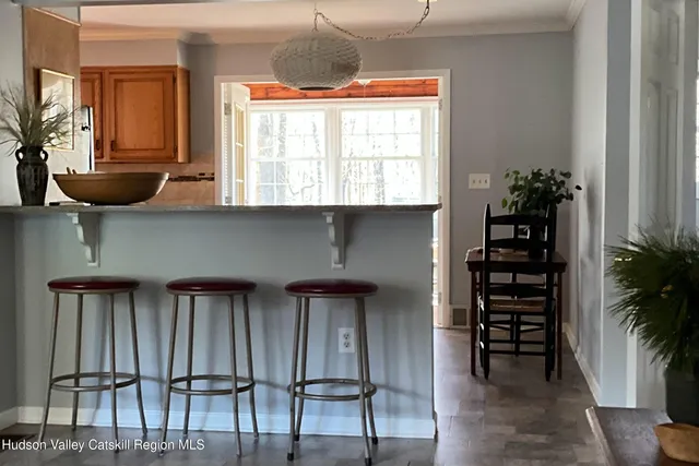 a view of a room with wooden floor and windows