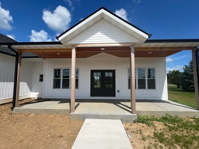 a view of a house with a garden