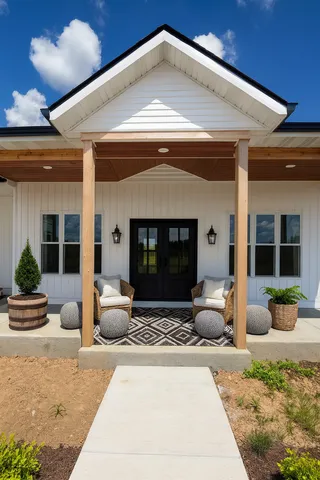 a front view of a house with outdoor seating