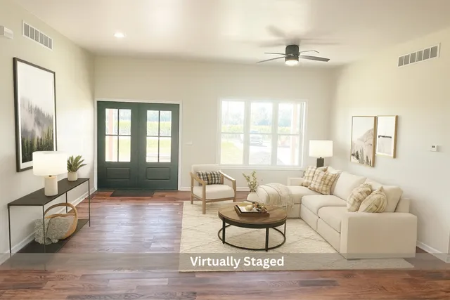 a living room with furniture or couch and a wooden floor