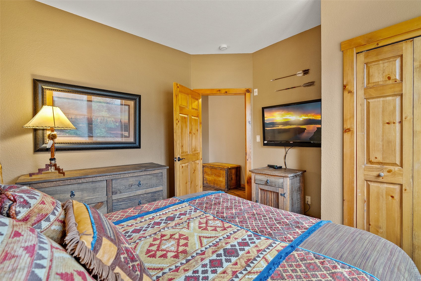 57 Lake Ridge Circle, Unit 1848 Keystone, CO 80435 - Photo 27 of 49 a bedroom with a bed and a flat screen tv