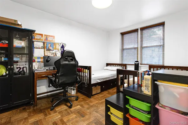 a bedroom with two beds and a window