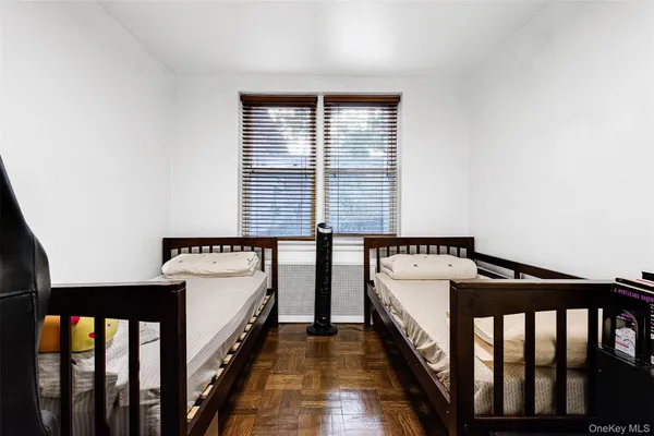 a view of bedroom with hardwood floor