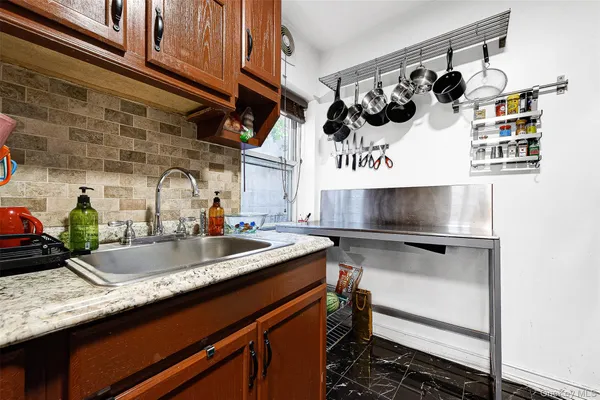 a kitchen with stainless steel appliances a stove a microwave and a refrigerator