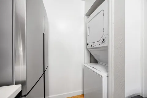 a hallway with washer and dryer