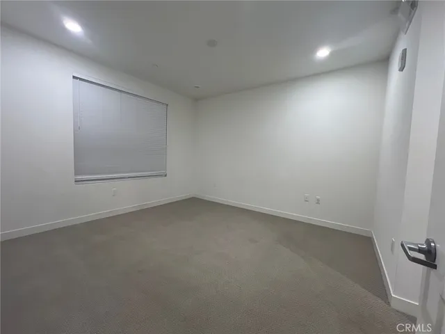 an empty room with a empty space and window
