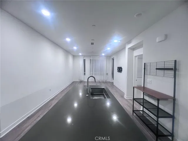 a bathroom with a sink and a large mirror