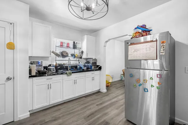 a kitchen with stainless steel appliances a refrigerator and a sink