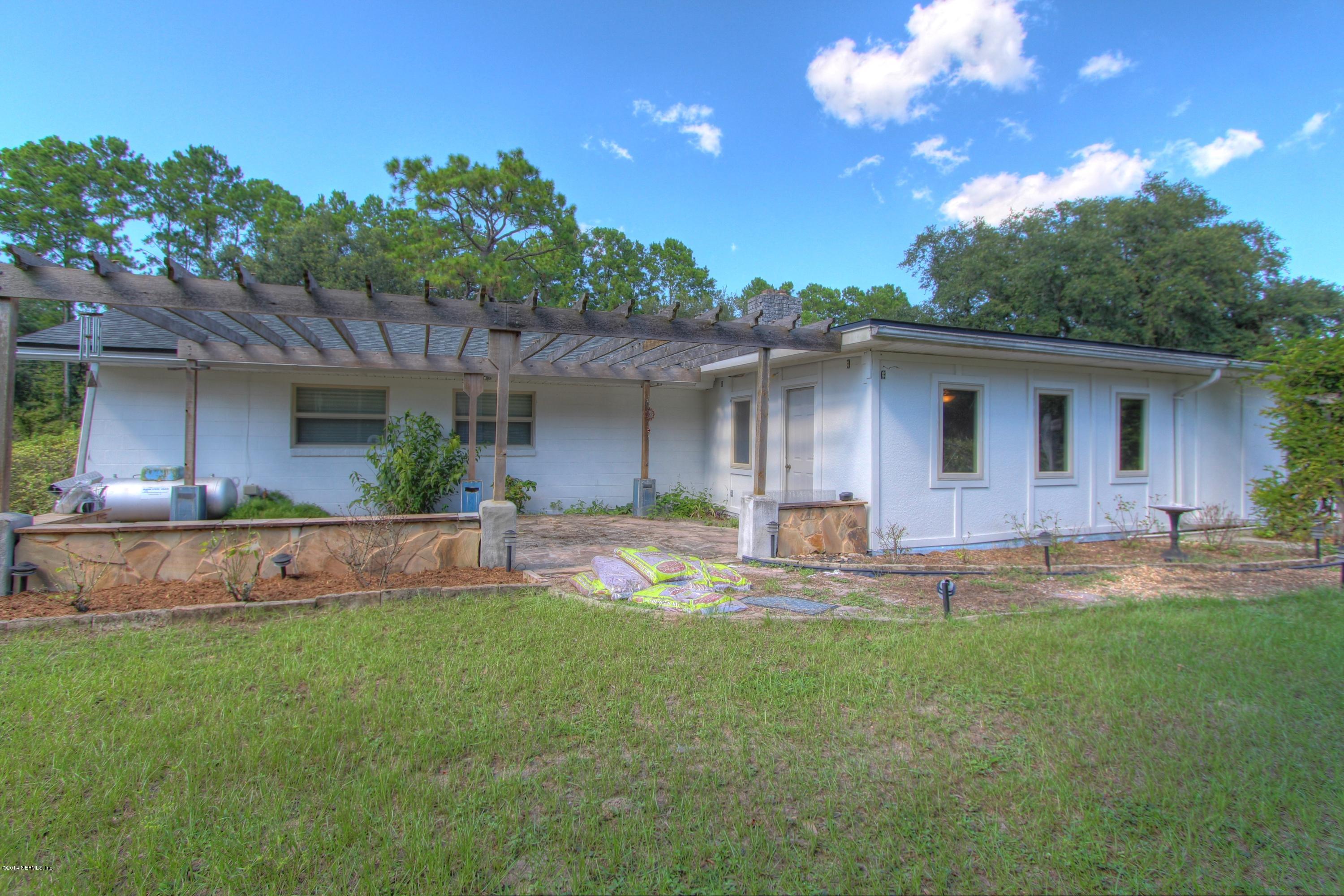 8976 Snellgrove Road Jacksonville, FL 32220 - Photo 8 of 43 Back of Home with Pergola