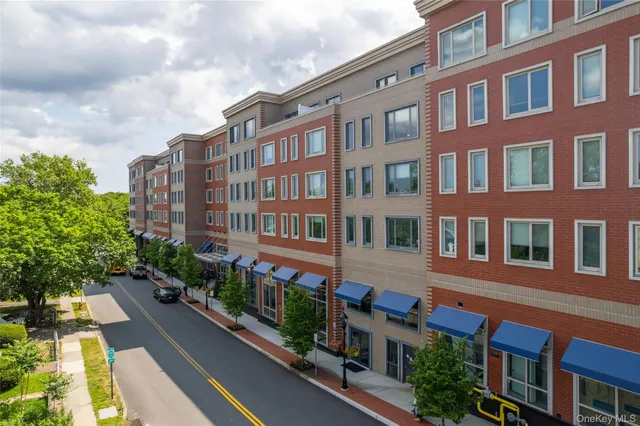 a view of a building next to a yard
