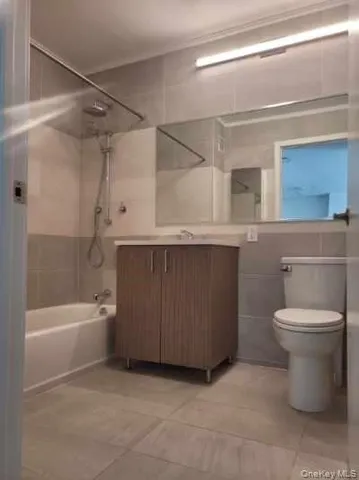 a bathroom with a sink a toilet and bathtub