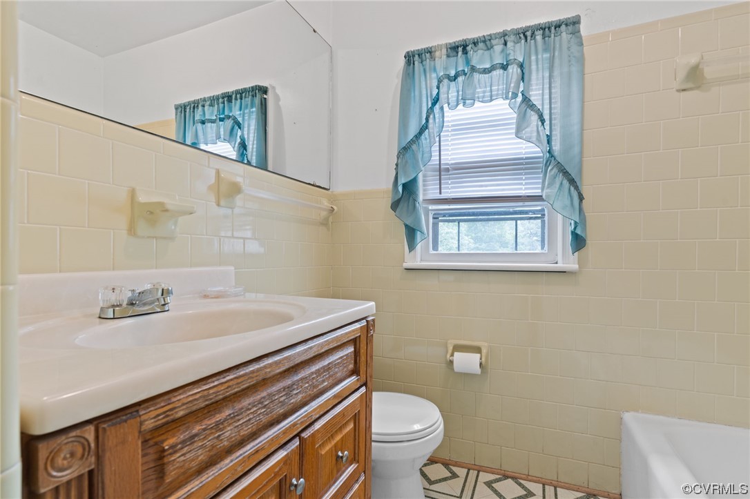 3980 Cedar Plains Road Sandy Hook, VA 23153 - Photo 13 of 18 a bathroom with a sink toilet and mirror