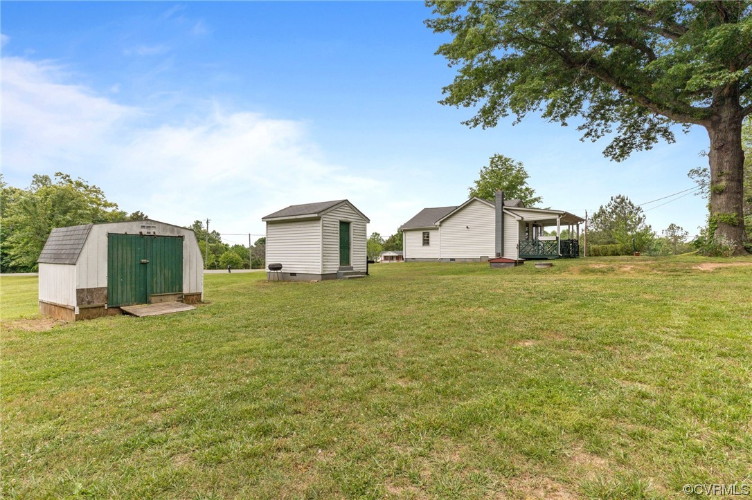 3980 Cedar Plains Road Sandy Hook, VA 23153 - Photo 15 of 18 a house view with a garden space