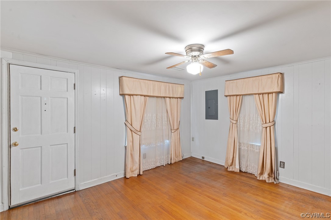 3980 Cedar Plains Road Sandy Hook, VA 23153 - Photo 4 of 18 wooden floor in an empty room with a window
