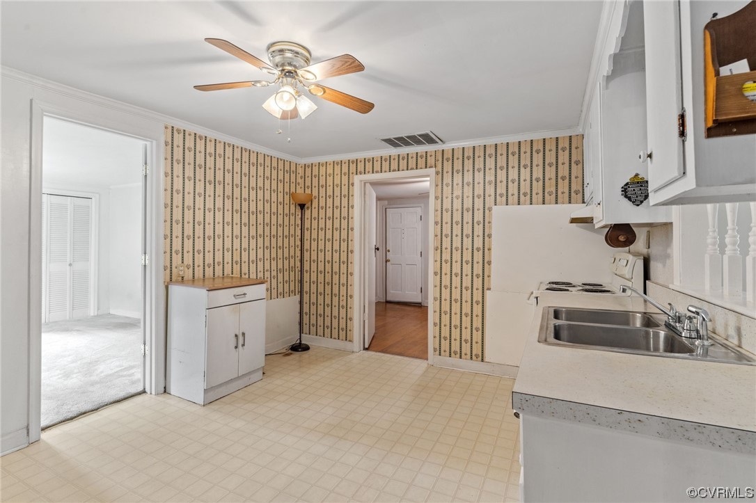 3980 Cedar Plains Road Sandy Hook, VA 23153 - Photo 8 of 18 a bedroom with a bed and a chandelier
