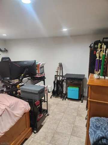 a bedroom with furniture and a gym