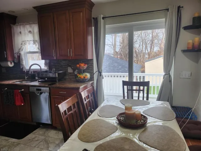 a kitchen with a sink and a potted plant