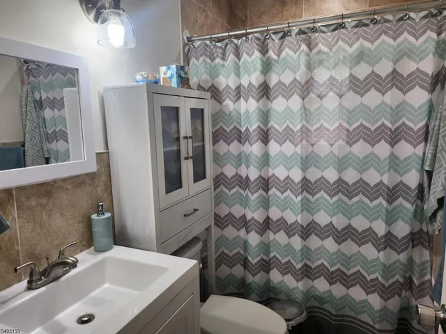 a bathroom with a sink and mirror