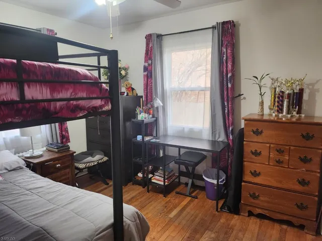 a bed room with a bed and a dresser