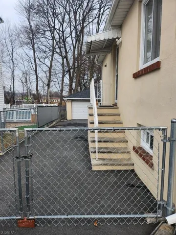 front view of a house with a bench
