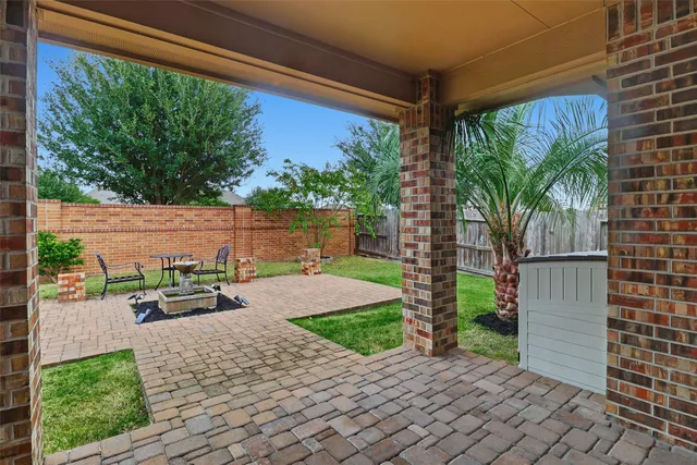 a view of a yard with potted plants