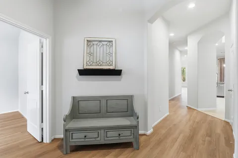a view of bedroom with furniture and wooden floor