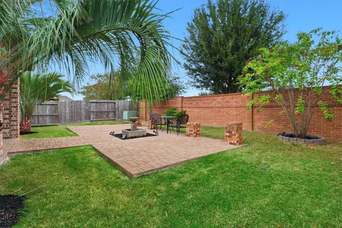 a view of a backyard with a patio