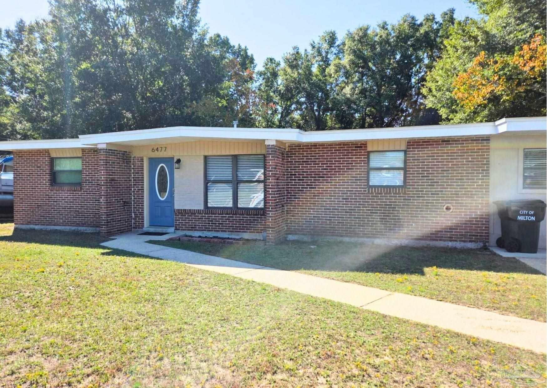 a view of a backyard with a large pool