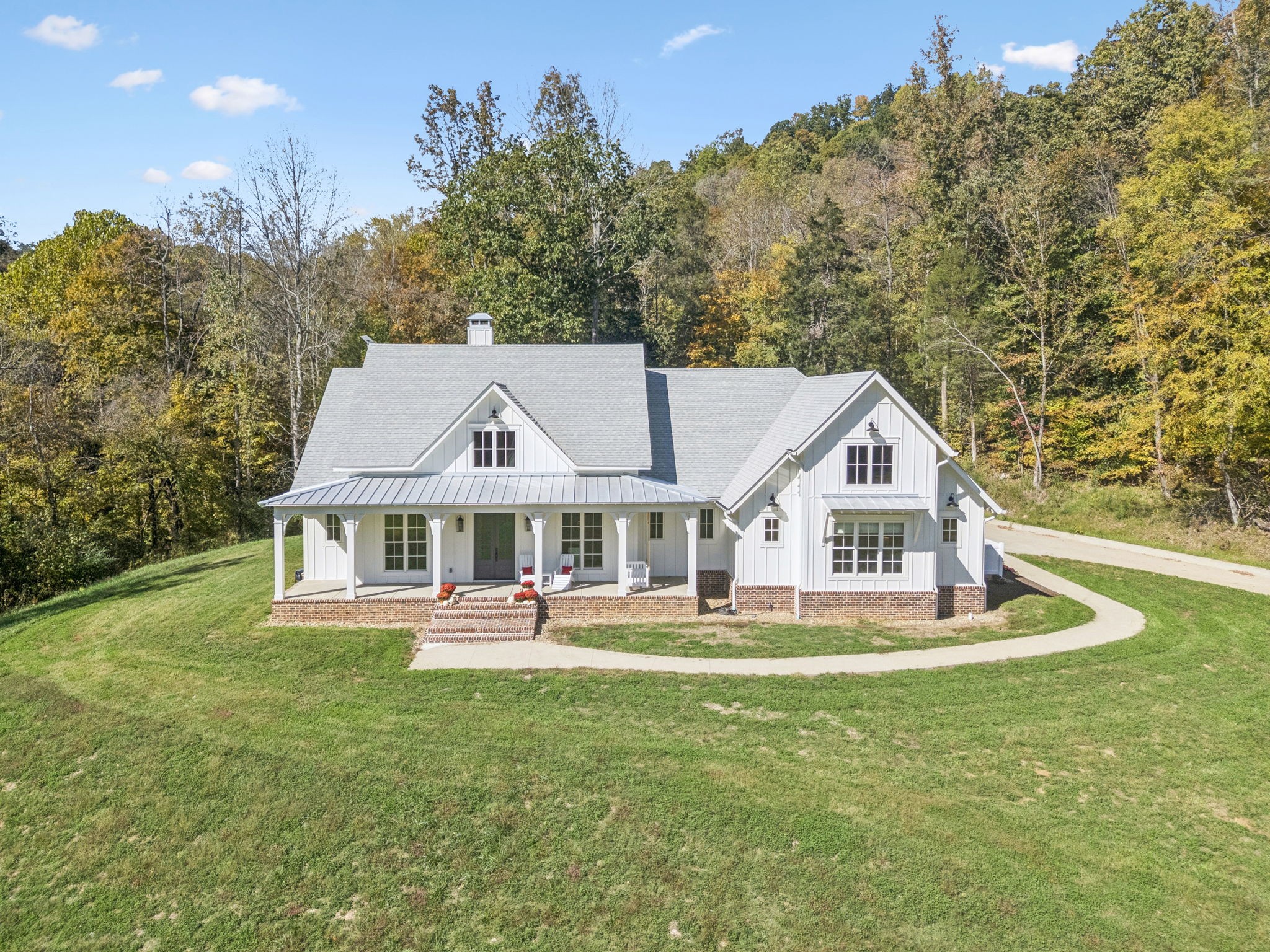 4388 Stenberg Road Whites Creek, TN 37189 - Photo 2 of 58 a front view of a house with a yard table and chairs