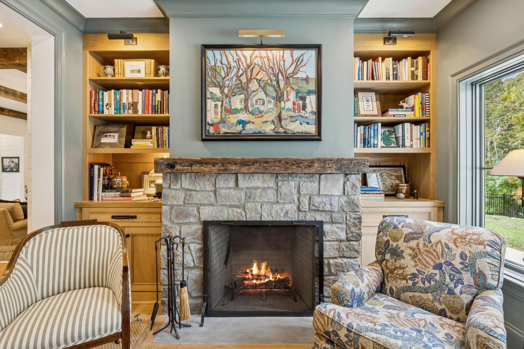 4388 Stenberg Road Whites Creek, TN 37189 - Photo 27 of 58 a living room with a couch a bookshelf and a fireplace