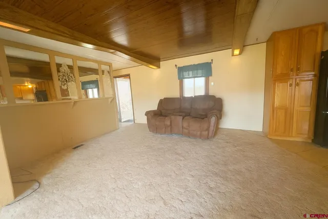a view of an empty room with a fireplace
