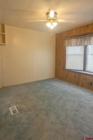 a view of a house with a mountain and a forest