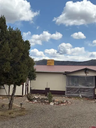 a view of a brick house with many windows