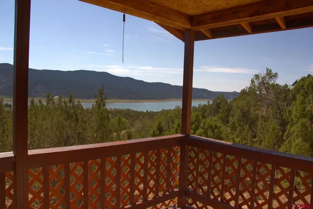 a view of a patio with a table and chairs