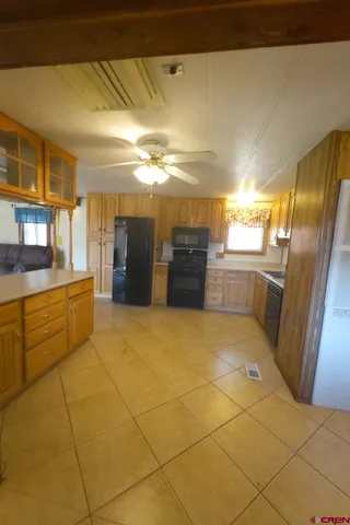 a bathroom with a granite countertop sink and washing machine