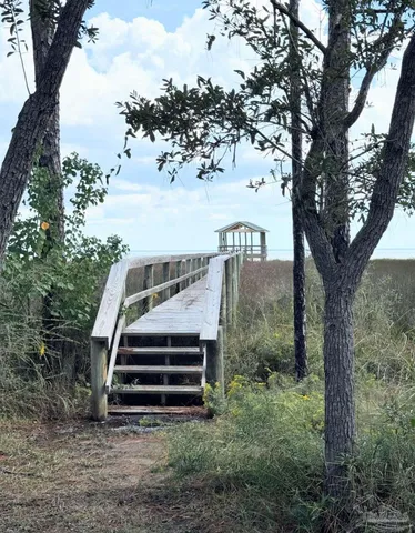 a view of a balcony with wooden floor