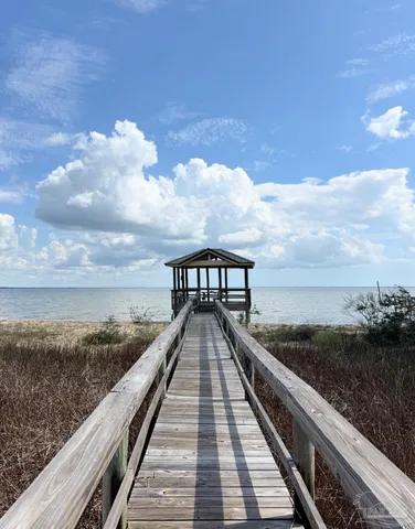 a view of a golf course with a lake