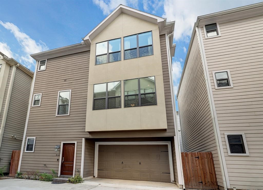 a front view of a house with garage